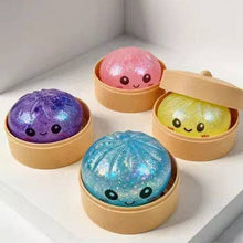 Load image into Gallery viewer, Golden Parrot - Glitter Dumpling Squishy
